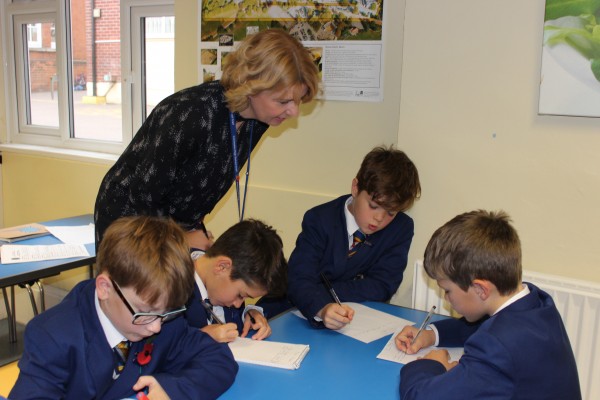 Lower School engage with teacher in class lesson